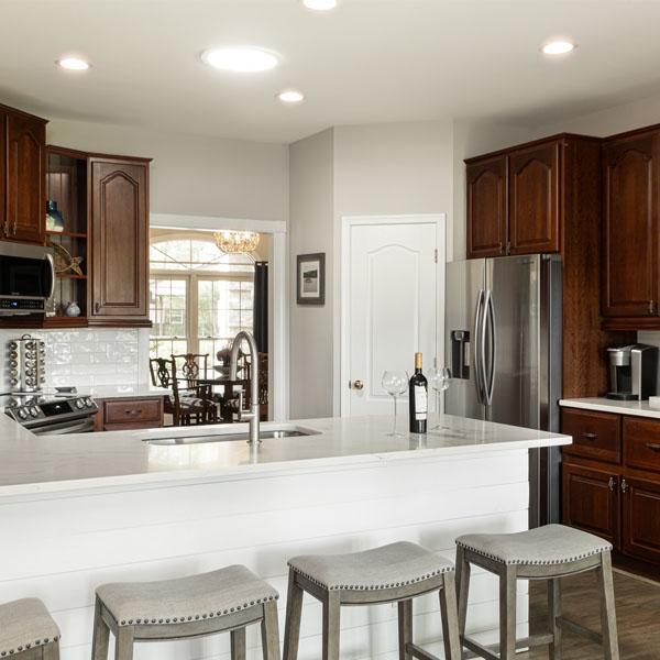 A spacious kitchen with marble counters and lots of cabinet space at The Nest at Swan Point airbnb vacation rental in Colonial Beach, Virginia.