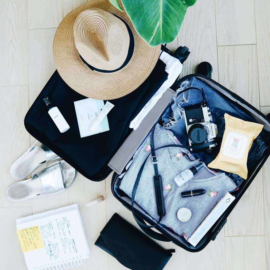 Opened suitcase with items neatly packed.