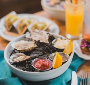 Seafood in bowls on a table in a restaurant.
